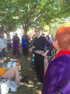 Rev. Robin Hynicka stands on holy ground to preach.